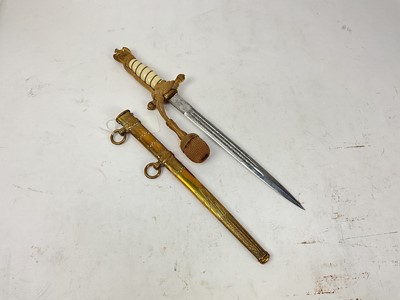 Lot 873 - Second World War Nazi 1938 pattern Kreigsmarine Dress Dagger etched, polished steel blade by Eickhorn Solingen, wire bound cream celluloid grip with portpee / dress knot, in brass scabbard.