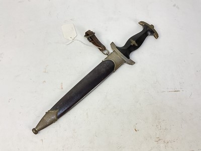 Lot 875 - Scarce Nazi SS model 1933 dress dagger, with ebonised wood grip and nickel plated fittings - the crossguard marked with 'I', the blade etched 'Meine Ehre heist True' and Rich Herder Solingen, retai...