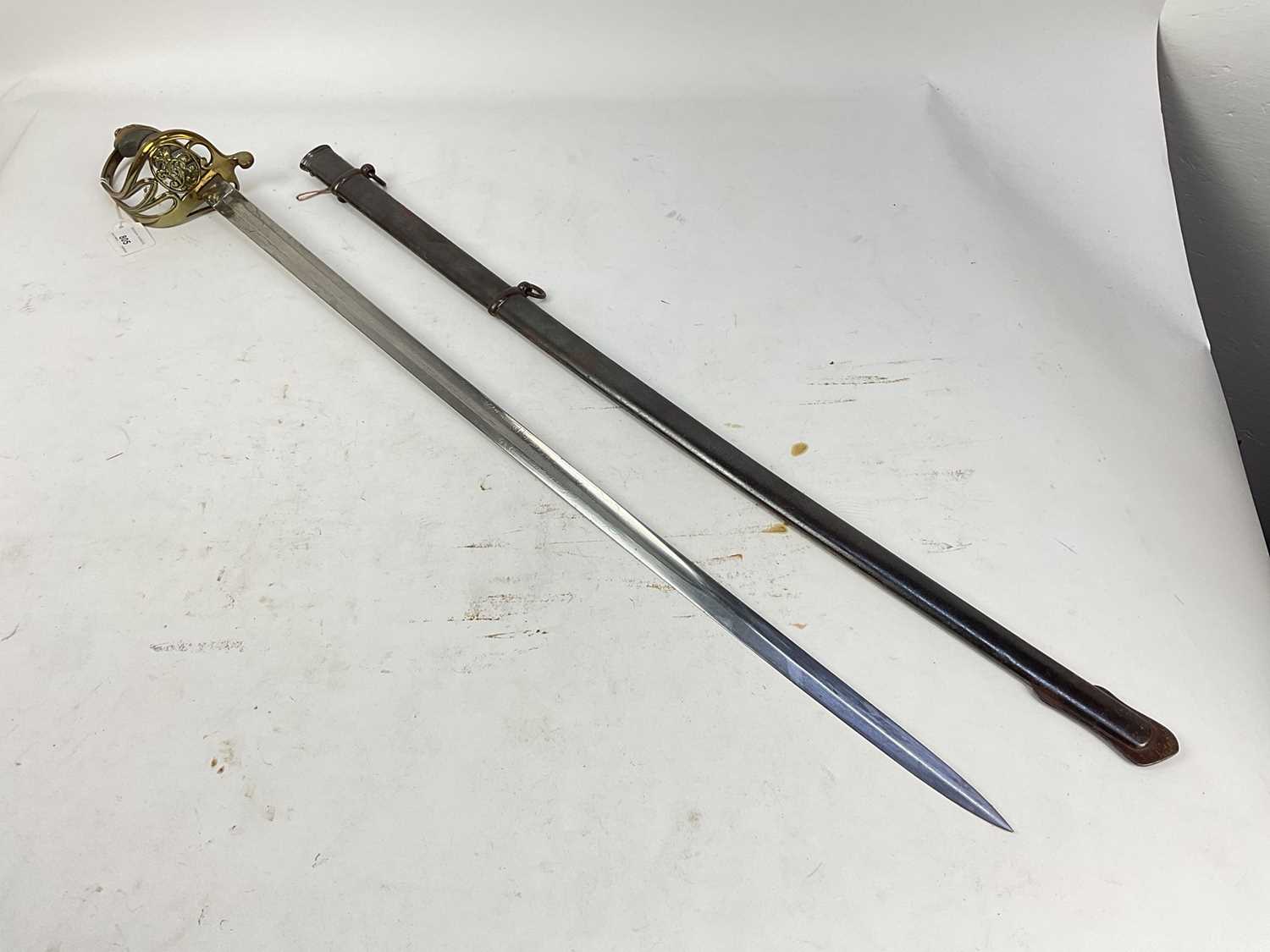 Lot 805 - Victorian 1845 Pattern Infantry officer's sword with brass Gothic hilt, etched fullered blade with crowned VR cipher in steel scabbard.