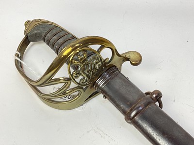 Lot 805 - Victorian 1845 Pattern Infantry officer's sword with brass Gothic hilt, etched fullered blade with crowned VR cipher in steel scabbard.