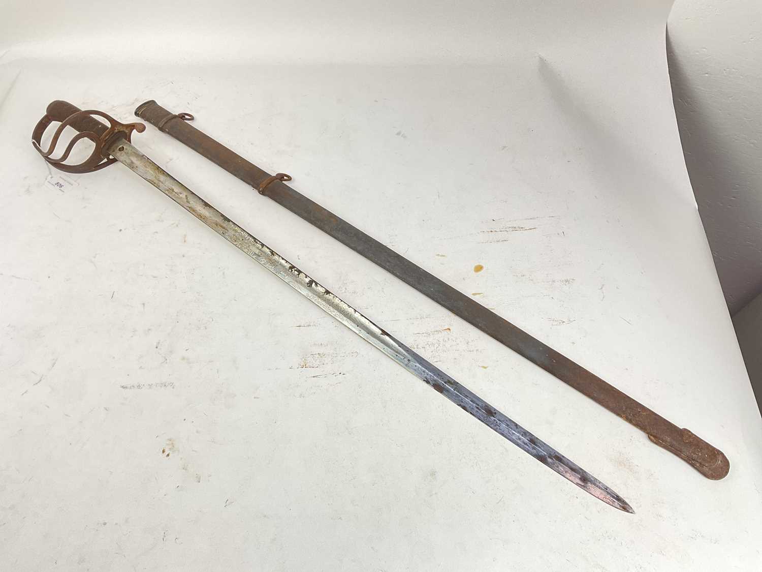 Lot 806 - Victorian 1822 Pattern Light Cavalry officer's Wilkinson Patent solid hilt sword with regulation three bar guard, etched blade with crowned VR cipher and Officers name 'A.D.Phelps' in steel scabbard