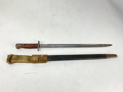 Lot 858 - First World War British 1907 pattern bayonet by Wilkinson, in steel mounted leather scabbard with canvas webbing frog.