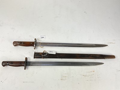 Lot 859 - First World War British 1907 pattern bayonet by Sanderson, in steel mounted leather scabbard, together with another with no scabbard (2).