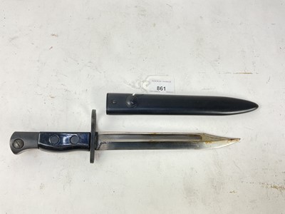 Lot 861 - British Sterling sub machine gun bayonet with black plastic grips, steel blade and painted steel scabbard.