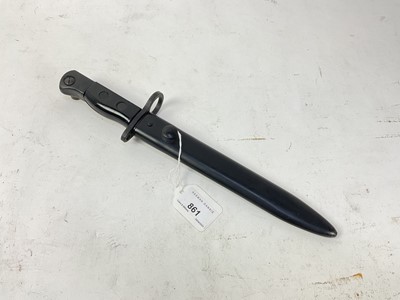 Lot 861 - British Sterling sub machine gun bayonet with black plastic grips, steel blade and painted steel scabbard.