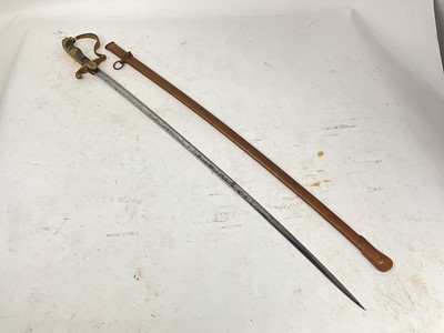 Lot 823 - Nazi Cavalry Officer's sword with brass lions head pommel and glass eyes, stirrup hilt with eagle and swastika langet, plain fullered blade in scabbard