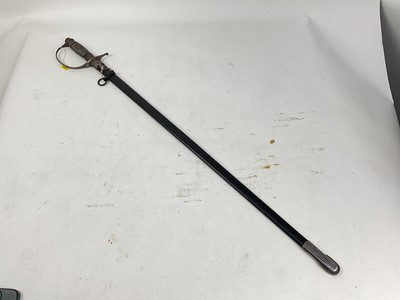 Lot 824 - Nazi Police sword with regulation stirrup hilt, eagle and swastika badge to grip, plain blade by Alcaso, Solingen in black painted scabbard