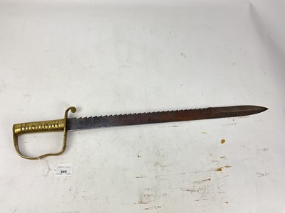 Lot 849 - British 1856 pattern Pioneers short sword with ribbed brass stirrup hilt and steel sawback blade by Wilkinson, London, no scabbard present.