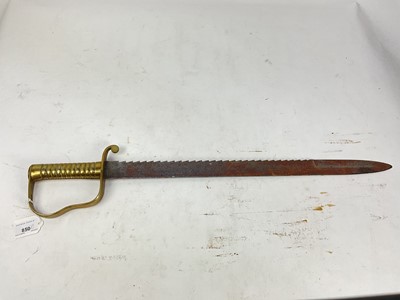 Lot 850 - British 1856 pattern Pioneers short sword with ribbed brass stirrup hilt and steel sawback blade, no scabbard present.