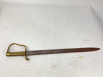 Lot 850 - British 1856 pattern Pioneers short sword with ribbed brass stirrup hilt and steel sawback blade, no scabbard present.