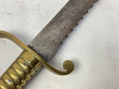 Lot 850 - British 1856 pattern Pioneers short sword with ribbed brass stirrup hilt and steel sawback blade, no scabbard present.