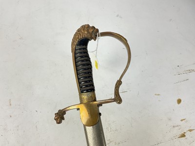 Lot 825 - 1920s Dutch Officer's sword with brass stirrup hilt and lions head pommel, plain plated curved blade marked ' Yzerhouwer' in nickel plated scabbard