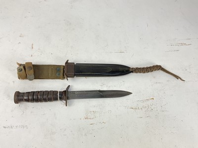 Lot 888 - Scarce American Second World War Trench/Fighting knife with ribbed hilt, steel blade stamped US M3 Imperial, in scabbard stamped US M8, with integral canvas webbing frog.