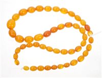 Lot 482 - Old amber bead necklace with a string of...