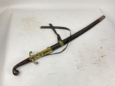 Lot 833 - 19th century Turkish Officer's sword with horn grips, brass crossguard, curved fullered blade in brass mounted leather sheath with crescent and star badge to the chape.