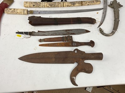 Lot 897 - Group of Eastern daggers and knives together with a fencing foil and a small leather covered baton (9)
