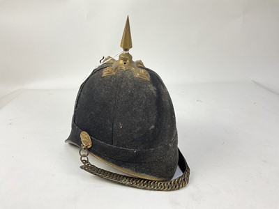 Lot 793 - Late Victorian/Edwardian Essex Regiment other ranks blue cloth helmet, the helmet plate missing, with brass spike and chin chains, with original silk and leather lining, Hawkes & Co makers stamp...