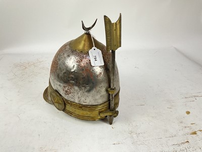 Lot 794 - Scarce Mid-19th century Ottoman helmet of the Egyptian Khedive's Bodyguard with steel skull, brass crescent moon cresting, brass band with arrow-shaped adjustable nose guard (lining and chin scale...