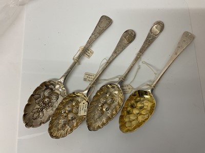 Lot 46 - Four Georgian and later silver table spoons, with later embossed and chased decoration as 'berry spoons' (various dates and makers), all at 8.9ozs.