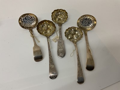 Lot 49 - Group of five Georgian and later silver sifter ladles, three with later chased and embossed decoration, (various dates and makers), all at 8.5ozs