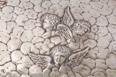 Lot 306 - Victorian  silver dressing table tray with embossed angelic heads