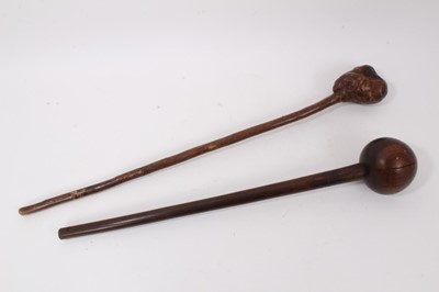 Lot 727 - African lignum vitae club and an Irish shillelagh with carved geometric patterns (2)