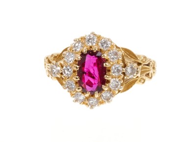 Lot 424 - Ruby and diamond cluster ring