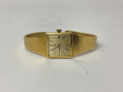 Lot 86 - Ladies Omega 18ct gold wristwatch on integral 18ct gold milanese strap.