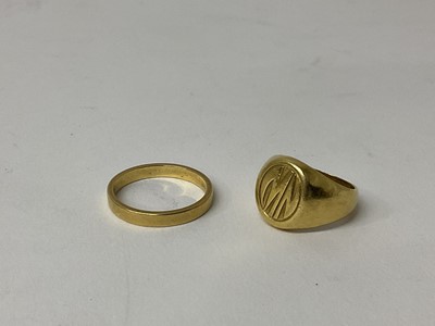 Lot 85 - 18ct gold wedding ring, marked 750, ring size P and a yellow metal signet ring, ring size J (2)