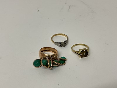 Lot 87 - 18ct gold and platinum diamond single stone ring, ring size P 1/2, 14ct gold ring, marked 585, ring size M and a yellow metal dress ring set with green stones, ring size L 1/2 (3)