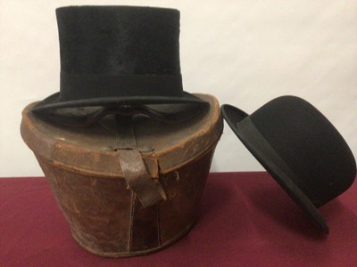 Lot 2076 - Black top hat by Thos.Townsend & Co, London in illustrated Stetson hat box,  two other black top hats and a leather top hat box. Also a black bowler hat by Woodrow Piccadilly.