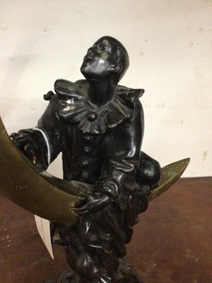 Lot 362 - After Colinet, bronze figure of Pierrot climbing a crescent moon on stepped marble base, 34cm high