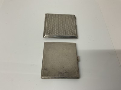 Lot 13 - George V silver cigarette case of square form with engine turned decoration and gilded interior, (London 1922), maker C&W Padgett, 8.3cm in overall length, together with another similar silver ciga...