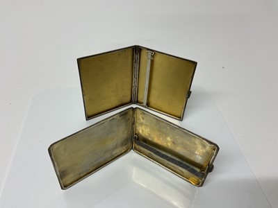 Lot 14 - George V silver cigarette case of rectangular form with engine turned decoration and gilded interior, (Birmingham 1930), maker William Neale Ltd, 10.5cm in overall length, together with another sim...