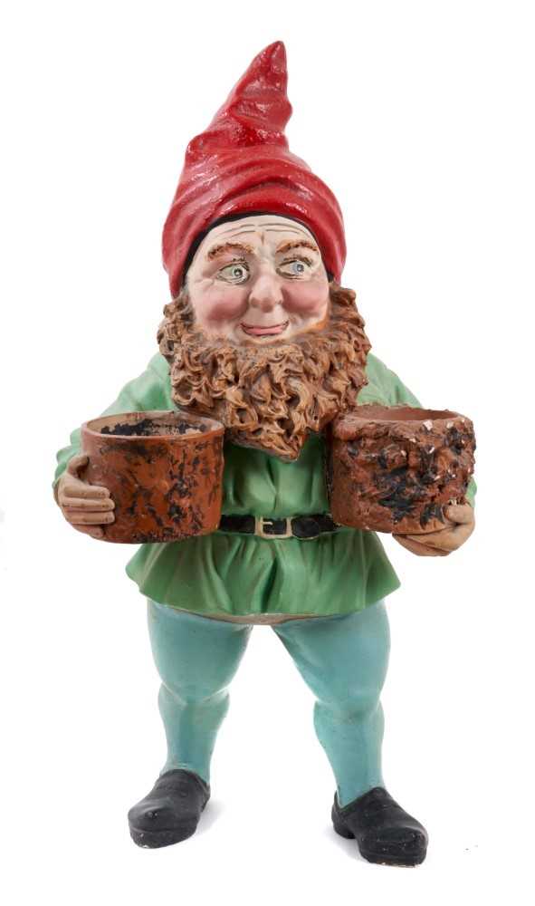 Lot 746 - 1920s German terracotta type garden Gnome with impressed marks (under flower pots) and another smaller (2)