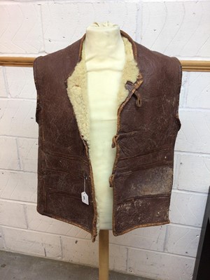 Lot 660 - Second World War period leather and sheepskin jerkin with button fasteners.