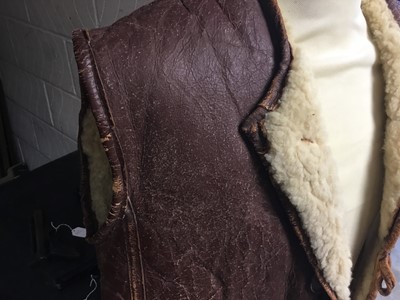 Lot 660 - Second World War period leather and sheepskin jerkin with button fasteners.