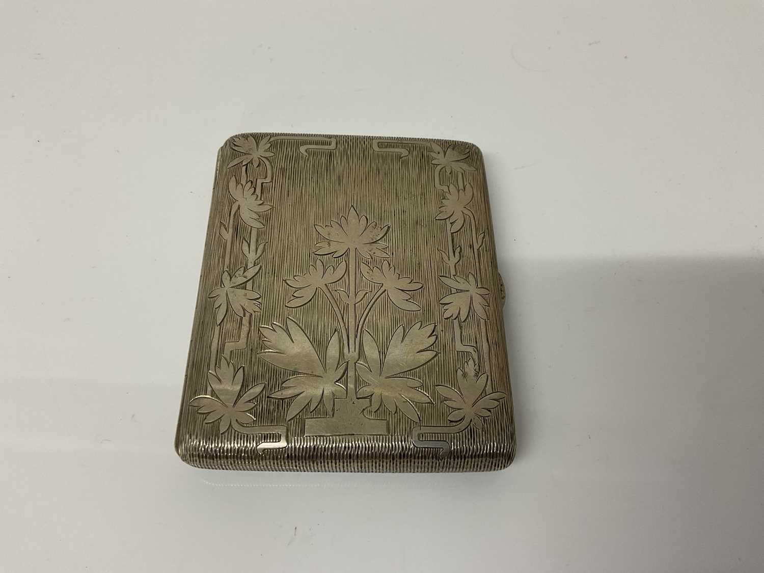 Lot 20 - Early 20th century Continental silver cigarette case of rectangular form with engraved decoration and gilded interior, (stamped 800 to interior), 9.5cm in overall length, all at 4.4ozs (2)