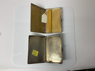 Lot 23 - George VI silver cigarette case of rectangular form with engine turned decoration and gilded interior, (Chester 1941), maker Cohen & Charles, 12.7cm in overall length, together with another similar...