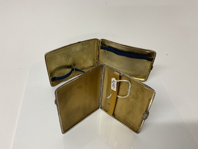 Lot 28 - George V silver cigarette case of curved rectangular form, (Birmingham 1919), maker William Henry Sparrow, 12cm in overall length, together with another silver cigarette case (Birmingham 1936), all...