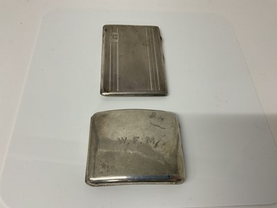 Lot 29 - George VI silver cigarette case of rectangular form with engine turned decoration, (London 1946), maker MG Ltd, 12.5cm in overall length, together with another similar silver cigarette case (Birmin...