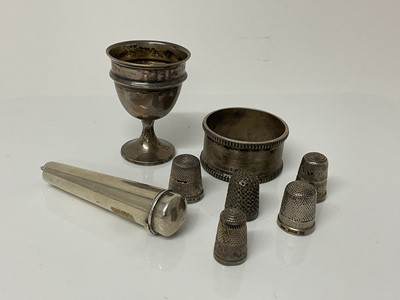 Lot 1046 - Small group of Victorian and later silver items to include a cheroot holder, (Birmingham 1899), a silver egg cup (Birmingham 1939), silver napkin ring (Birmingham 1936) and five silver thimbles (va...