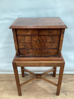 Lot 1333 - Early 18th century walnut feather-banded table cabinet on later stand