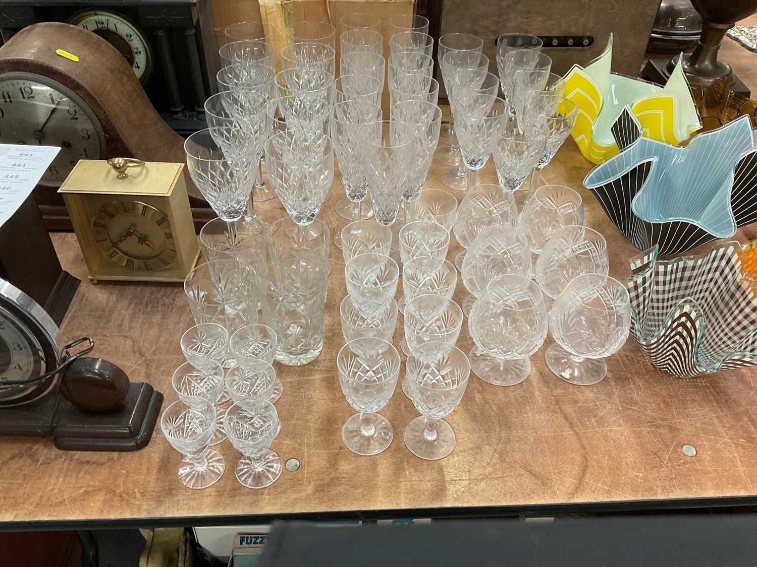 Lot 433 - Suite of cut glass ware to include champagne flutes and brandy balloons.