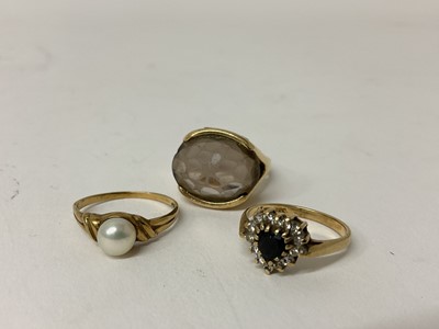 Lot 73 - 9ct gold dress ring set with a pearl, size N 1/2, together with a 9ct gold heart shaped gem set dress ring, size M 1/2 and another 9ct gold dress ring, size P, (2). 11.9 grams