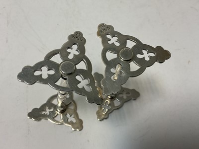 Lot 121 - Pair of silver knife rests with pierced trefoil ends