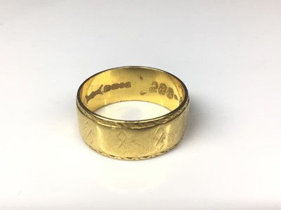 Lot 135 - 22ct gold wide band wedding ring with engraved geometric decoration