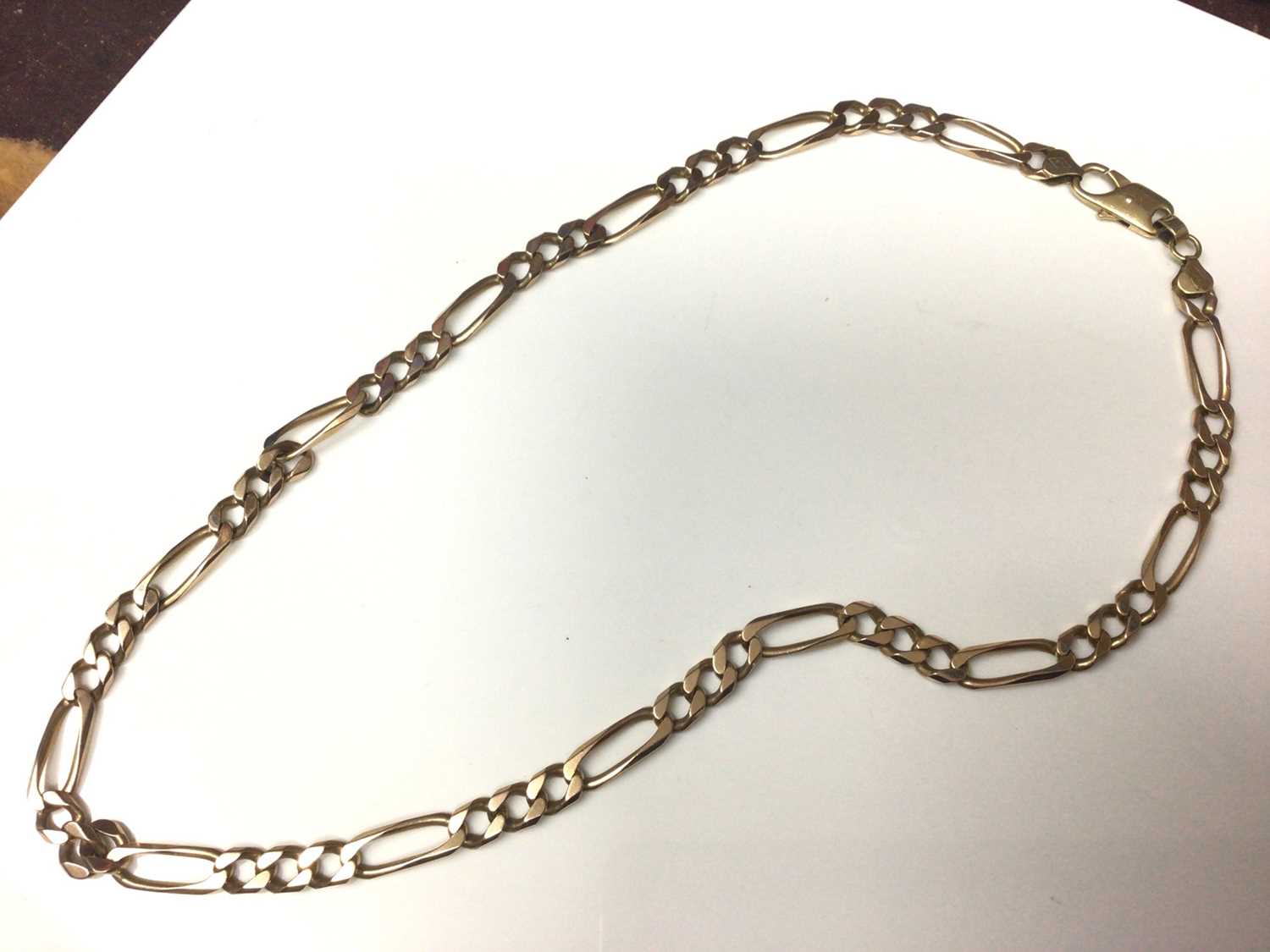 Lot 158 - 9ct gold flat curb link chain, 60cm long