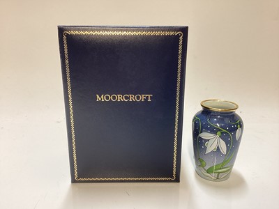 Lot 1243 - Moorcroft enamel Snowdrop vase, in original box