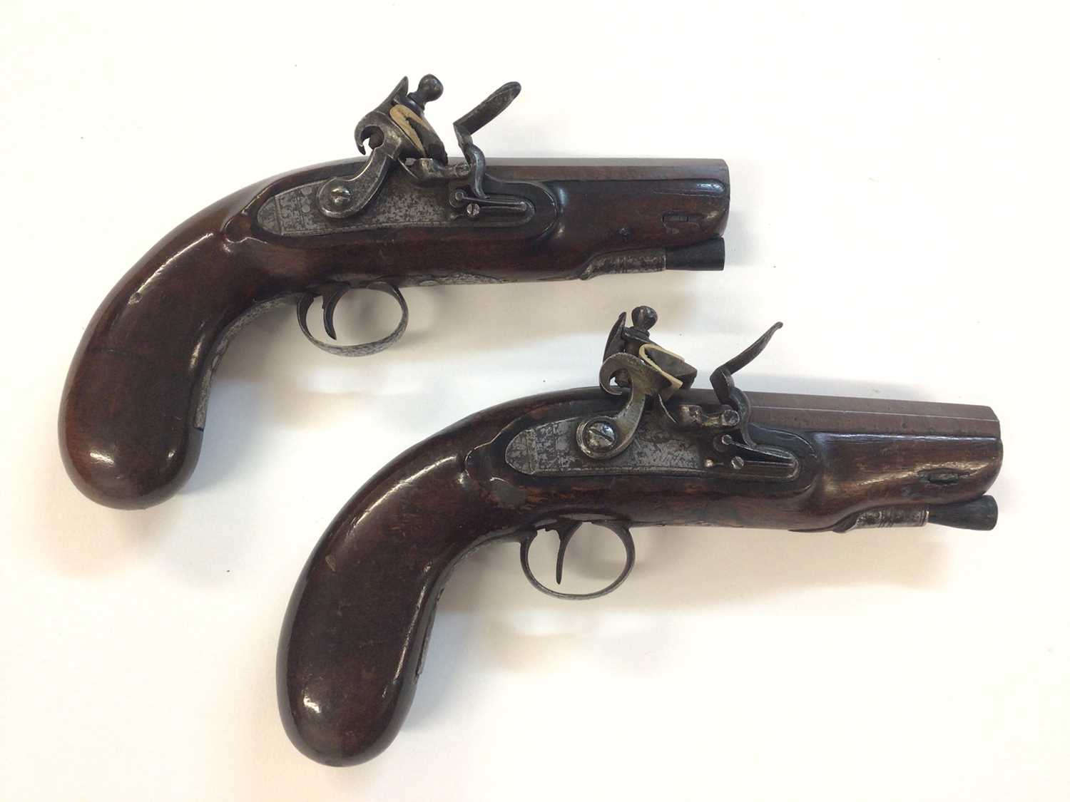 Lot 955 - Pair Early 19th century 16 bore flintlock overcoat pistols